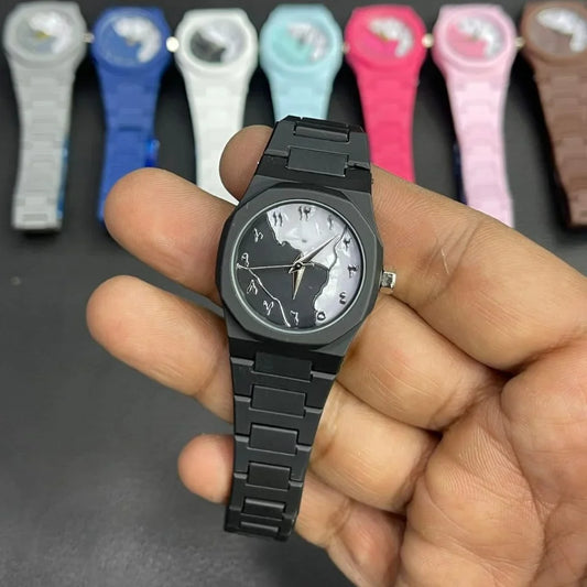 Close-up of a black women's wrist watch featuring a black and white marble pattern dial, silver hands, and a matching silicone strap, with multiple color variants displayed in the background.
