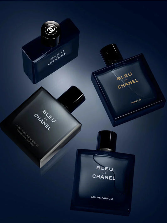 Bleu de Chanel perfume bottles displayed on a dark background, showcasing the iconic luxury men's fragrance collection with elegant dark blue packaging and a sophisticated premium design.