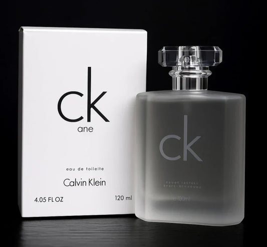 Calvin Klein CK One perfume bottle and original packaging displayed on a black background, showcasing the iconic minimalist design and fresh unisex fragrance appeal.