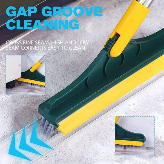 Gap groove cleaning tool with a green and yellow handle being used to clean dirt and debris from a narrow seam between two surfaces, designed for precision cleaning in corners, grout lines, and hard-to-reach spaces.