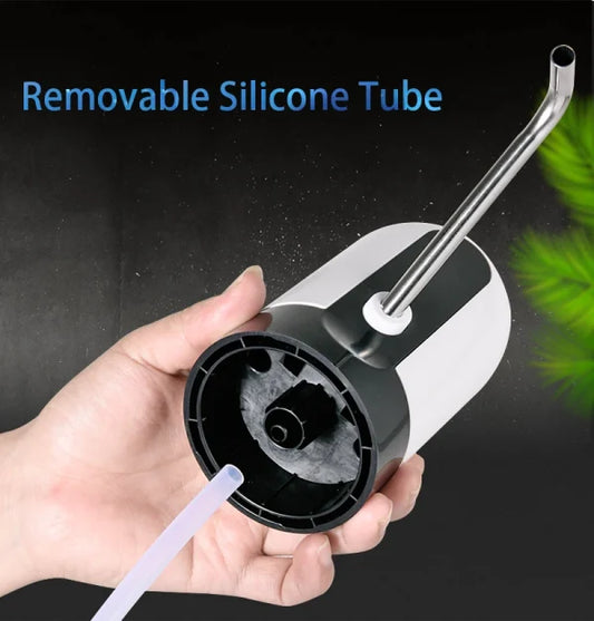 Hand holding a portable water pump device with a removable silicone tube against a dark background, highlighting its detachable design for easy installation, cleaning, and convenient water dispensing.