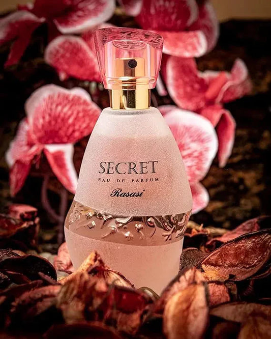 Secret perfume bottle displayed with decorative floral elements on a flower-themed background, highlighting a feminine fragrance with an elegant design and a luxurious, romantic presentation.