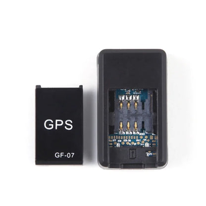 GPS GF-07 tracking device displayed on a clean white background with the product label visible. Compact GPS locator device designed for real-time location tracking, vehicle monitoring, personal security, and smart tracking solutions.